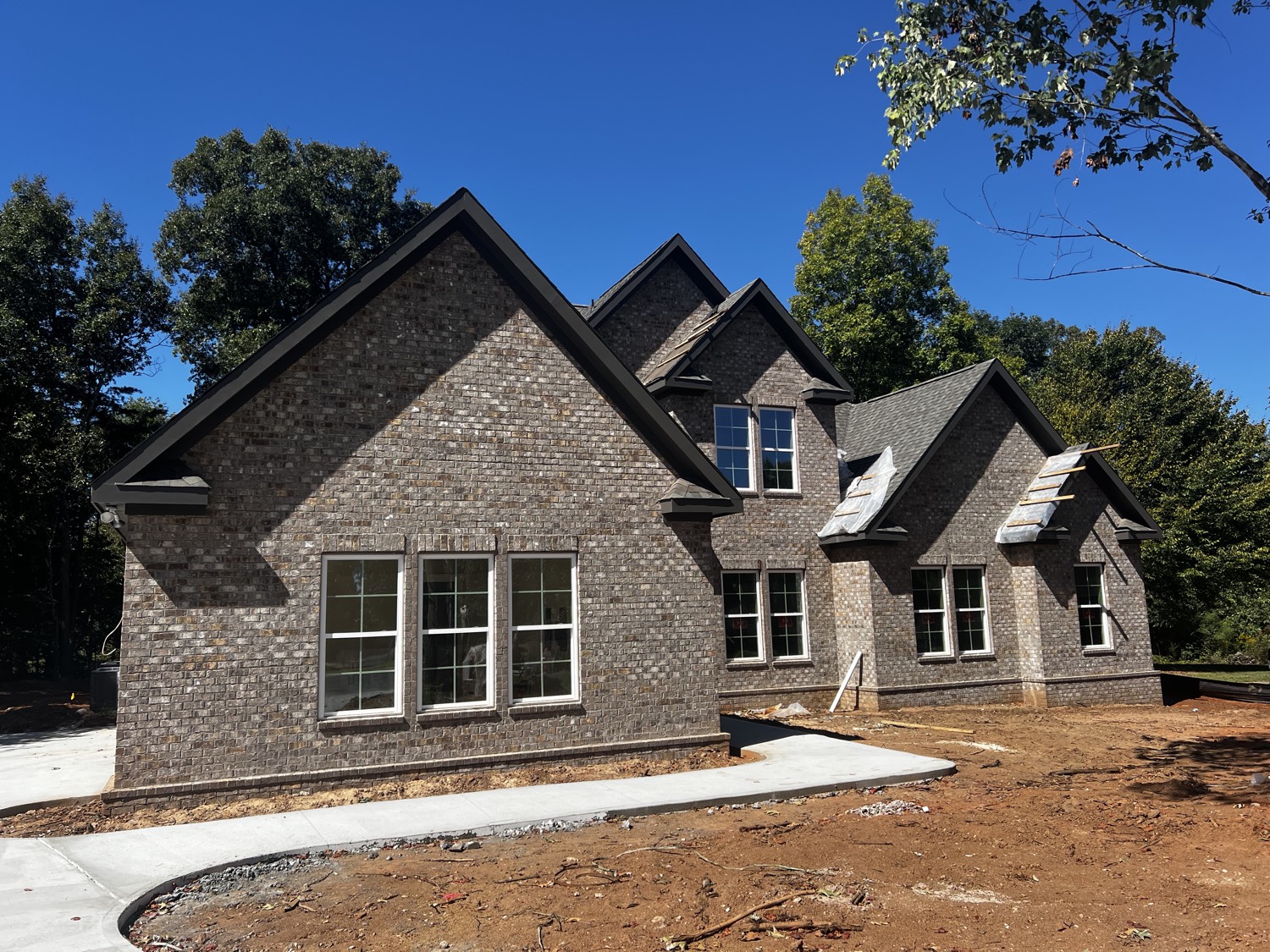 The Hampton, all-brick, at 119 Beacon Hill Road in Duncan — driveway and walk poured